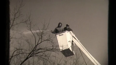 Workers in Crane Close to Electrical Poles and Electricity Cables Video stock 129863768