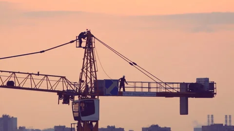 Workers on crane sunset Video stock 92627477