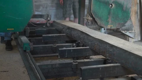 Workers Cut The Logs Into Boards Sawmill With a Circular Saw in the Shop Stock Footage 76642866