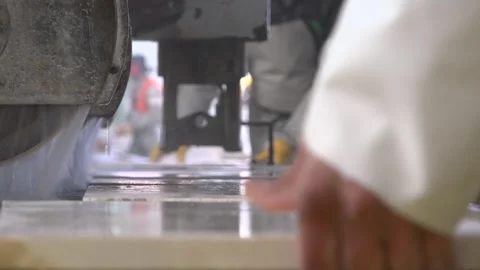 Workers cut white marble with water in an active processing factory - Hands Work Stock Footage 339351096