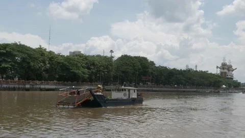 Workers in debris cleanup vessel removing garbage on the river Stock Footage 156994710
