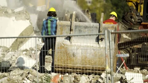 Workers on demolition site watching - 4K Stock Footage 69178147