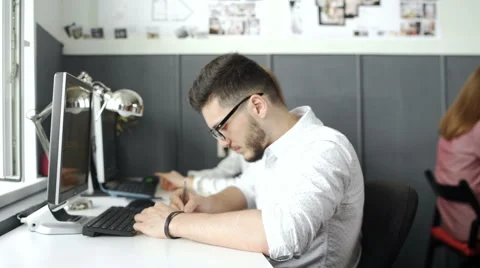 Workers At Desks In Busy Creative Office. 20s 4k Stock Footage 68207255
