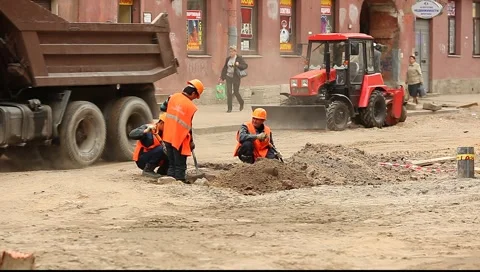 Workers digging pit on the street Stock Footage 5094173
