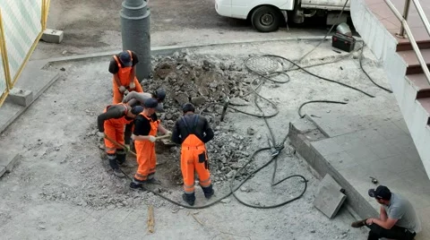 Workers digging with shovels at the construction site Stock Footage 68769832