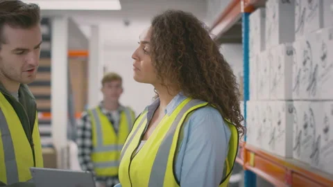 Workers With Digital Tablet In Warehouse Training Male Intern Standing By Stock Footage 179626441