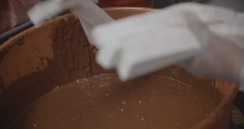 Workers Dipping Sweets In Melted Chocolate In Slow Motion 스톡 동영상 105346695