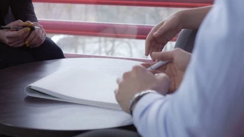 Workers discussing about the business development at the office Stock Footage 73885633