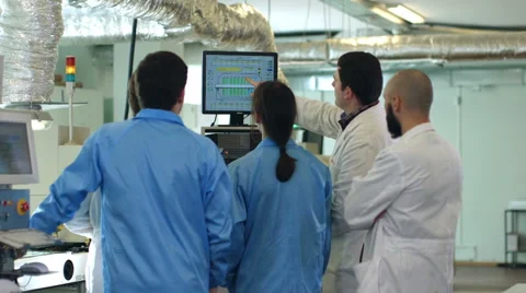 Workers discussing financial graph Stock Footage 50304553