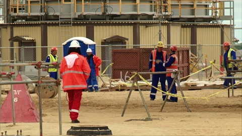 : Workers Discussing Plans at Construction Site Video stock 294085509