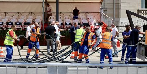 Workers dismantling festivity setup Stock Photos