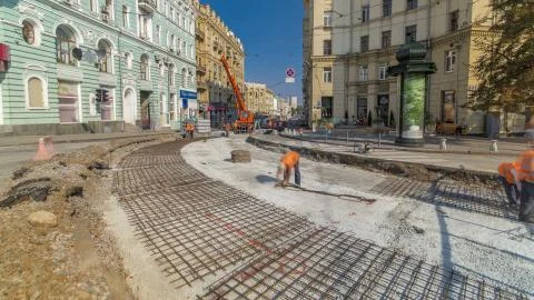 Workers do cutting reinforcement for tram tracks in the city timelapse Fotos de archivo
