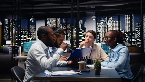 Workers doing business meeting to plan project in relaxed atmosphere office Stock Photos