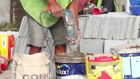 Workers doing cement drills Stockbeeldmateriaal 243418563