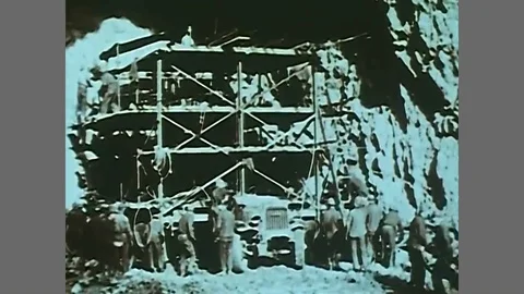 Workers dynamite and excavate and change the course of the Colorado River into Stock Footage 88678348