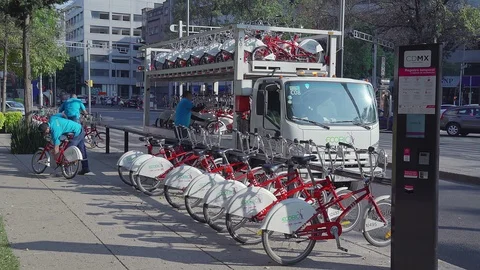 Workers Ecobici bicycle rent accommodate bicycles Stock Footage 101143788
