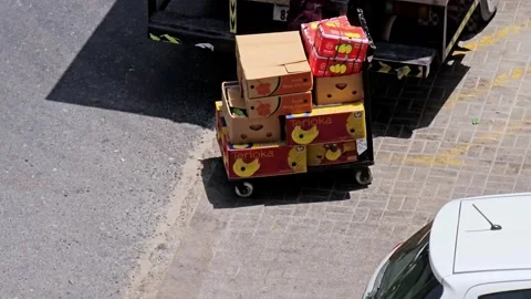 Workers efficiently unload vibrant fresh fruits from Delivery Truck Video stock 311886564