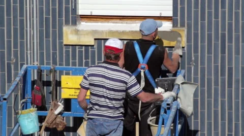 Workers on the elevator restoring building Stock Footage 49482832