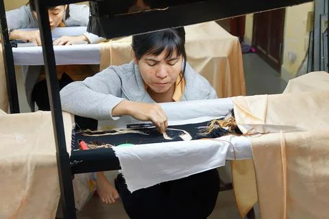 Workers embroider with silk Stock Photos