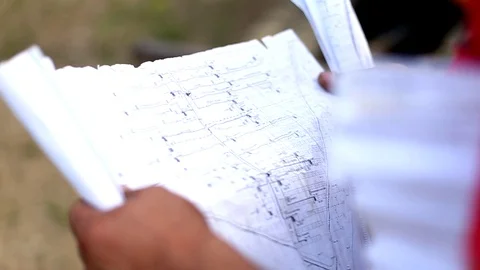 Workers engineers reading and talking about the new renewable energy project Stock Footage 105176429