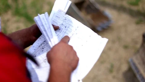 Workers engineers reading and talking about the new renewable energy project Stock Footage 105176442