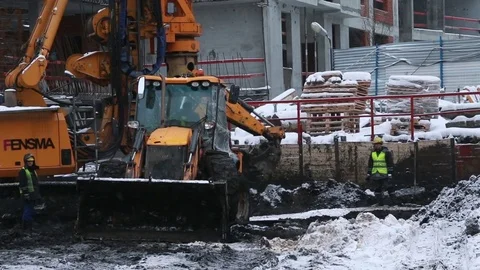 Workers, excavator and pile rig machine at construction site. Stock Footage 71532850