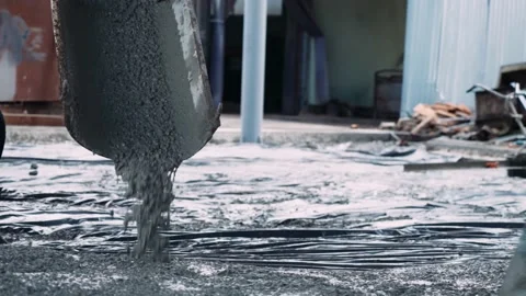 Workers fill the foundation of the building with cement. Filling concentrate for Stock Footage 200792202