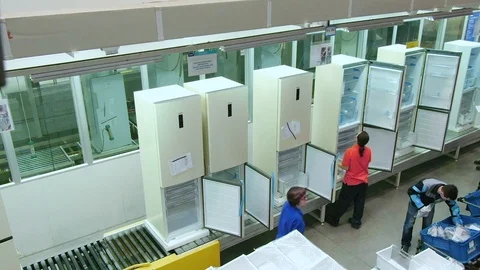 Workers finish fridges assembling at plant view from above Stock Footage 107899390
