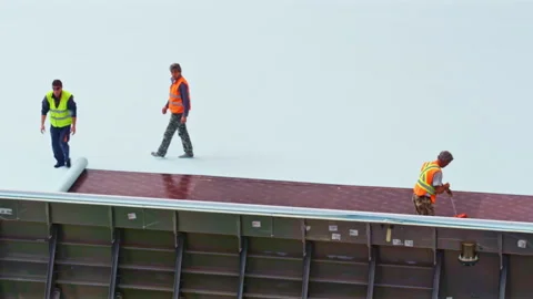 Workers finish to lay flooring for modern swimming pool Stock Footage 231778376