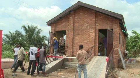 WORKERS FINISH THE NEW SANITATION FACILITY Stock Footage 59865610