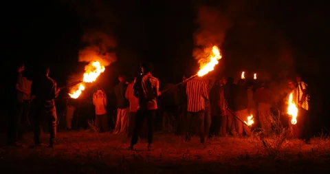 Workers with Fire Torch in Night Stockbeeldmateriaal 339776620