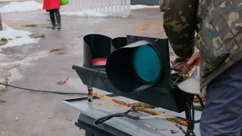Workers fix the lights of a broken traffic light Stock Footage 168496036