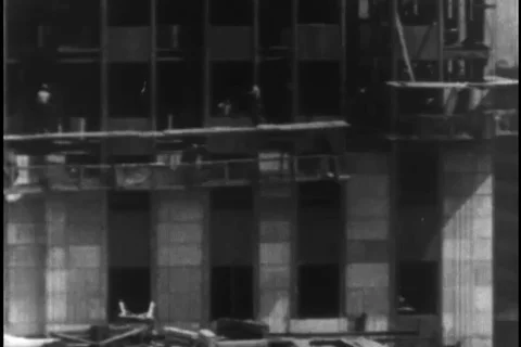 Workers fix the structural base during construction - 1930 Stock Footage 104336478