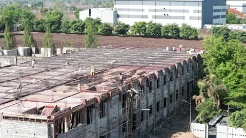 Workers Fixing Steel Rebar on Construction Site Slab at Building Development Stock Footage 340153910