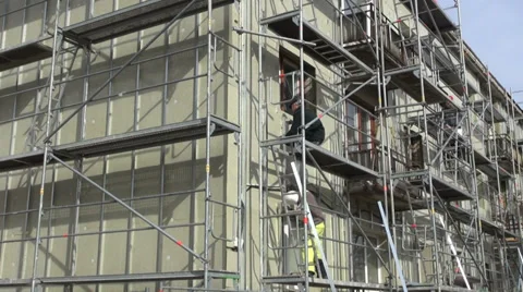 Workers fixing thermal insulation material rock wool on house wall Stock Footage 39490891