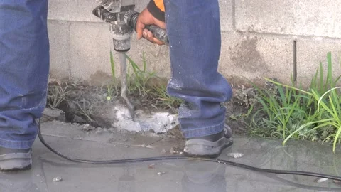 Workers Fixing A Water Leak And Using A Jack Hammer To Break The Cement Stock Footage 204094970