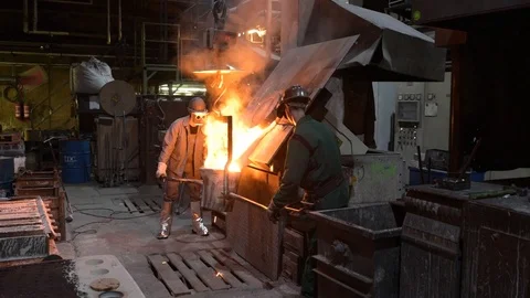 Workers in a foundry for the production and processing of metal and steel Stock Footage 97225749
