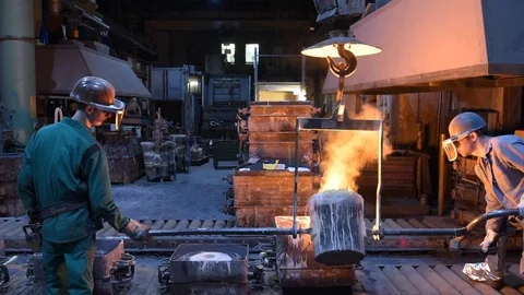 Workers in a foundry for the production and processing of metal and steel Stock-Footage 97226087