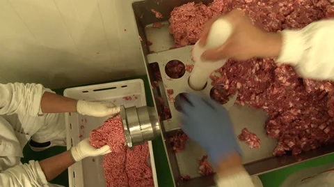 Workers grind the meat on the machine Stock Footage 52876280