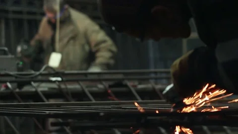 Workers grinding metal with a circular saw Stock Footage 72068351