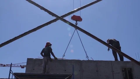 Workers guiding crane Stock Footage 77099692