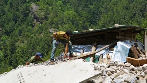 Workers hammering the destroyed wall with a mallet Stock Footage 77445946