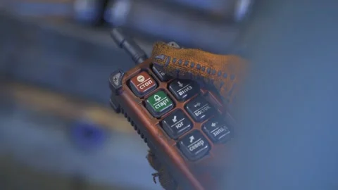 A worker's hand adjusts the device Stock Footage 288485060