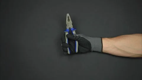 Worker's hand holds instrument for house repair. Stop motion Stock-Footage 242942653