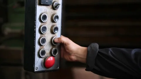 Workers hand press button on remote control closeup Stock Footage 70208113