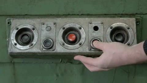 Worker's hand presses buttons on old electrical unit Stock Footage 87725752