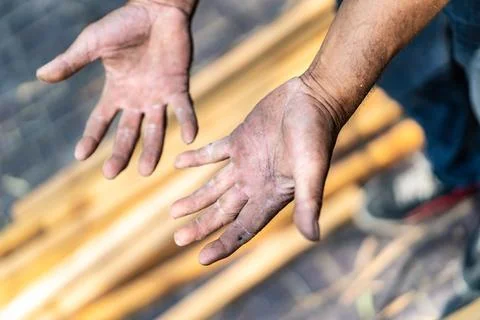 Worker's hand very hard working in the field of construction carpenter and .. Stock Photos