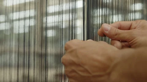 Worker's hands check the quality of the thread in a textile factory Stock Footage 291870905