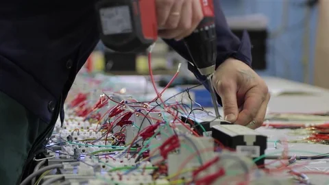 Worker’s hands is connects electrical products and equipment Stock Footage 75565697