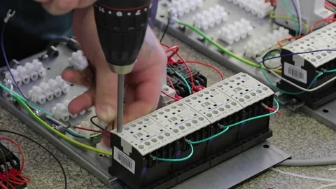 Worker’s hands is connects electrical products and equipment Видео 75565705